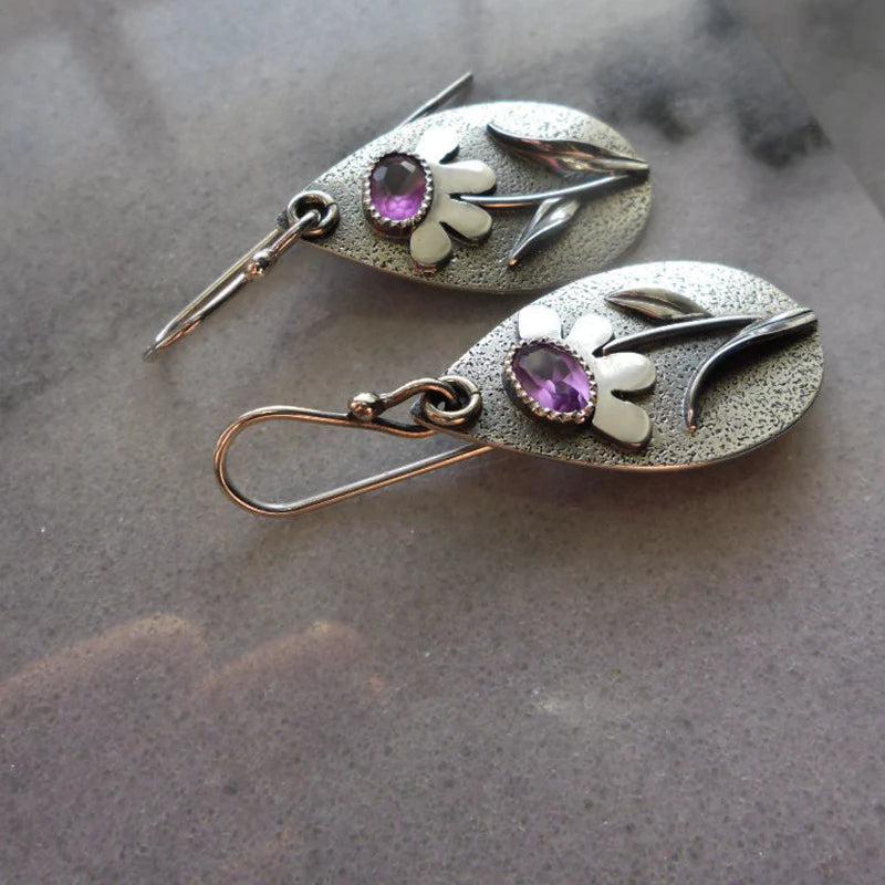 Vintage earrings featuring 3D floral designs
