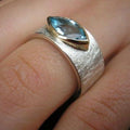 Drop ring with blue gemstone inlays