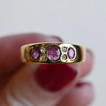 Vintage gold rings with pink crystal.