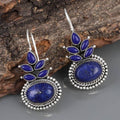Bohemian earrings featuring blue opal and sterling silver floral accents