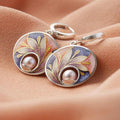Acrylic earrings adorned with pearls