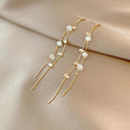 Elegant dangling earrings adorned with pearls and cubic zirconia