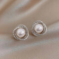 Shimmering spiral earrings with elegant pearls