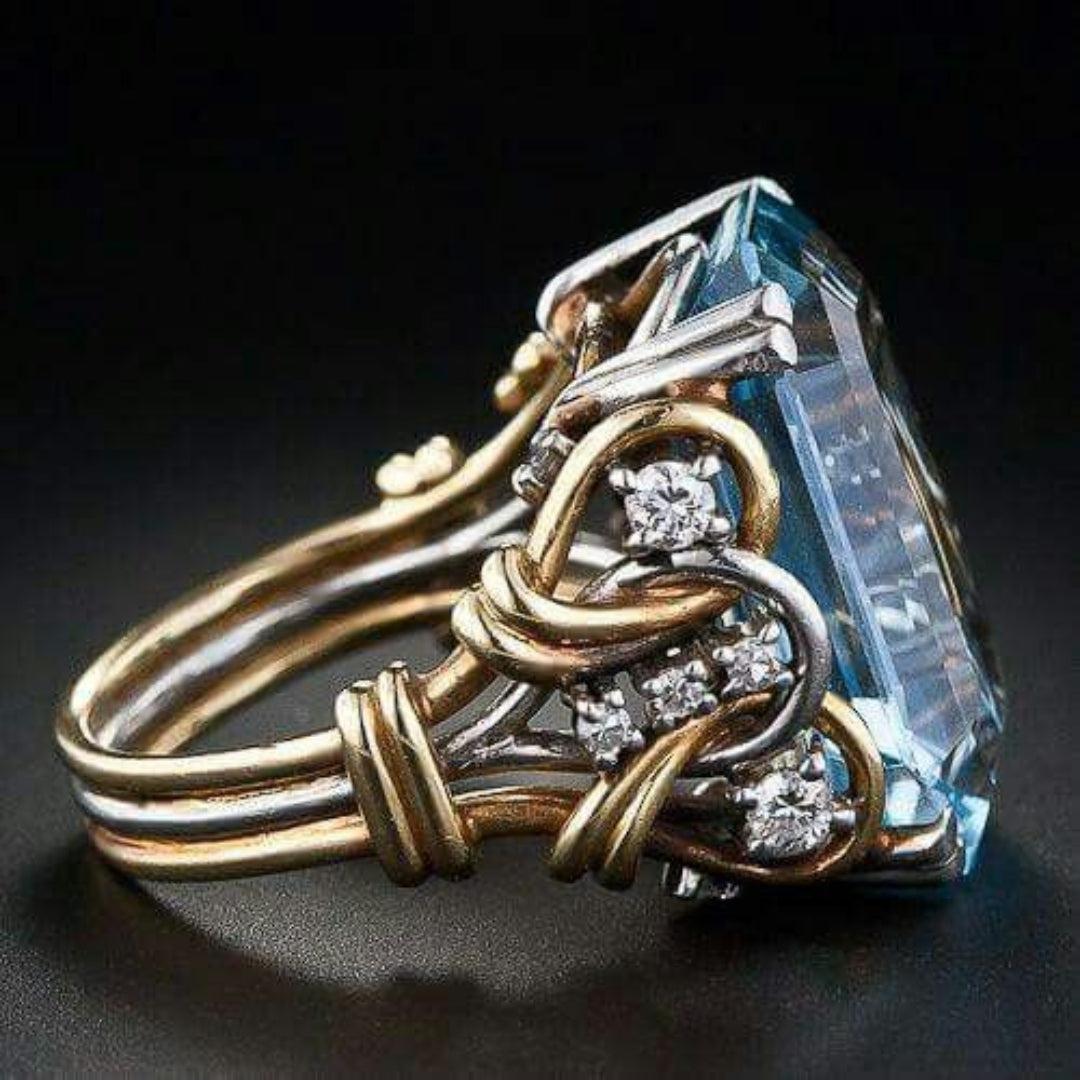 Gold ring featuring a vintage-style blue zircon.