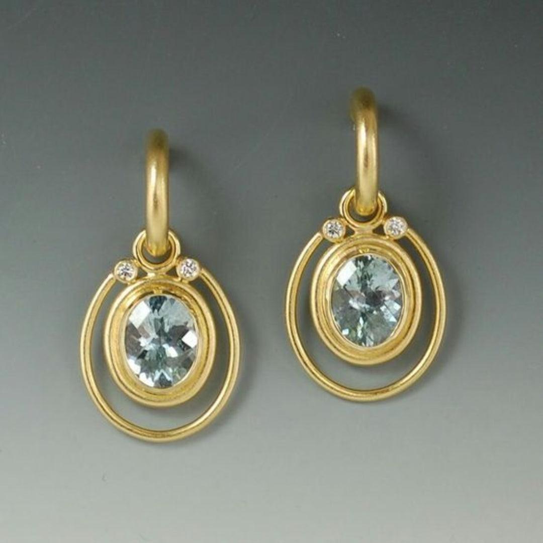 Vintage golden earrings with blue crystal inlay