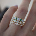 Vintage rings featuring white and green opal