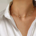 Gold Spaced Pearl Chain Pendant Necklace