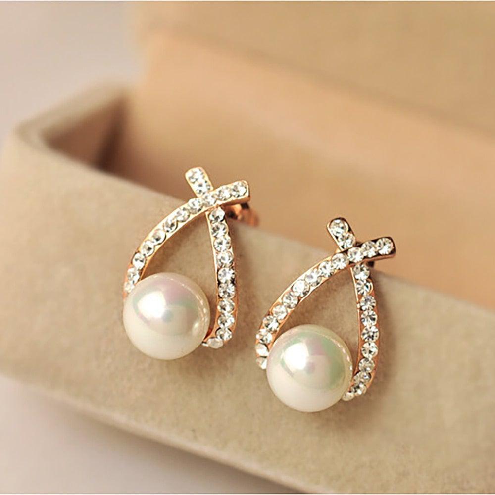 Glittering pearl earrings.