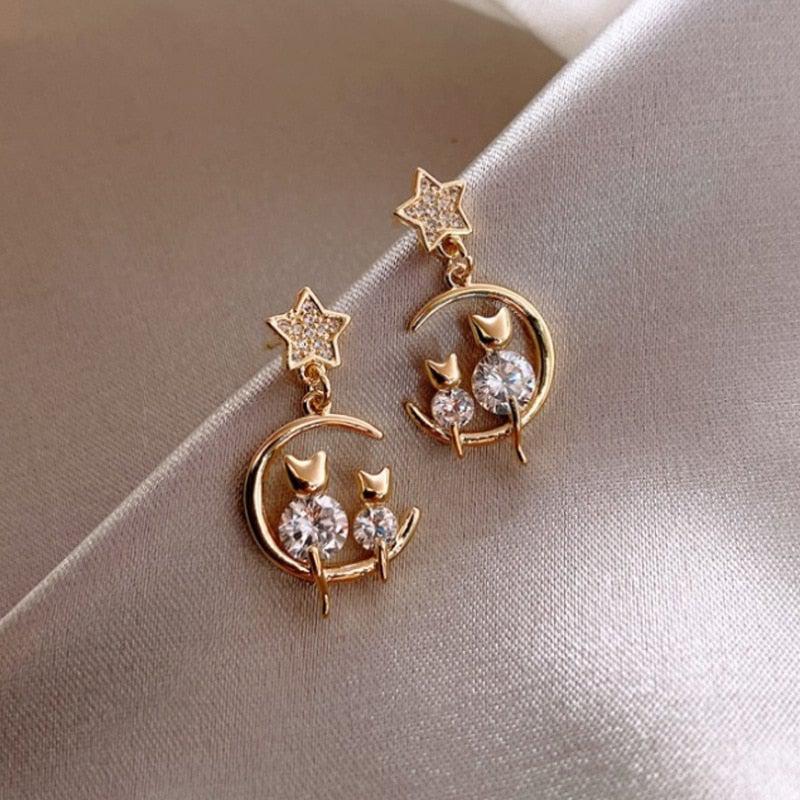 Luxurious kitten family crafted from ironite with embedded earrings.