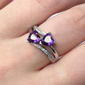 Elegant ring featuring a purple crystal set in silver.