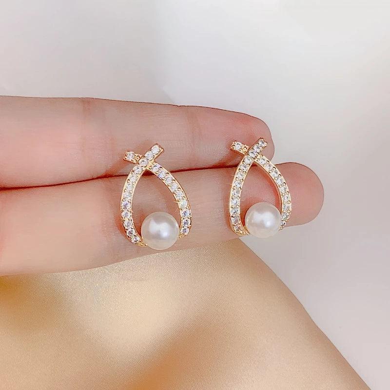 Glittering pearl earrings.