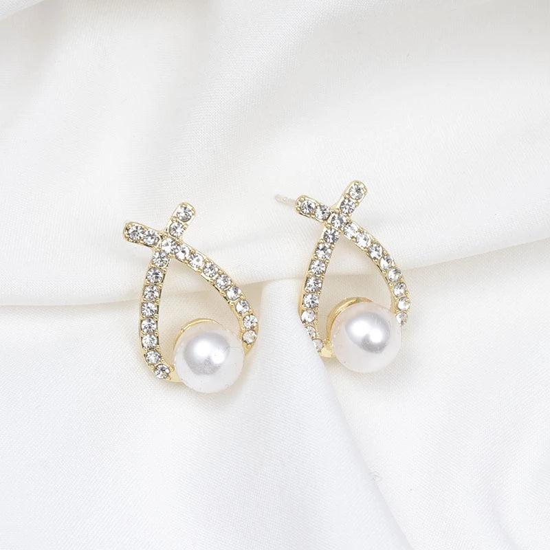 Glittering pearl earrings.