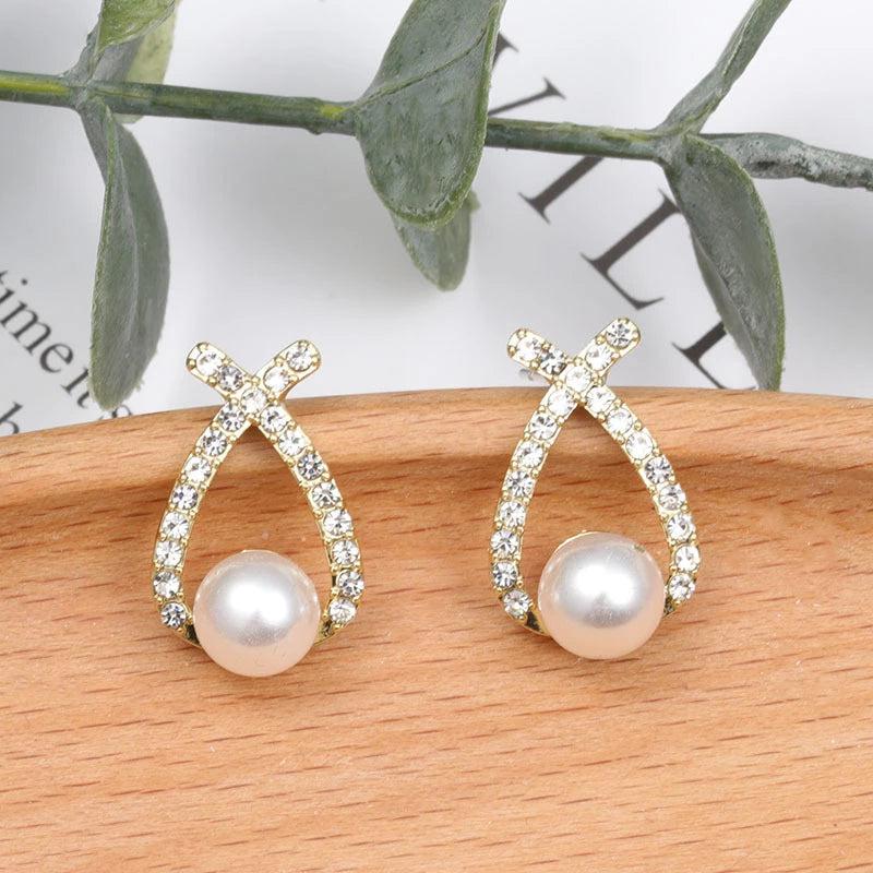 Glittering pearl earrings.