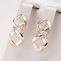 Elegant Gold Earrings with Zirconia and Knotted Design
