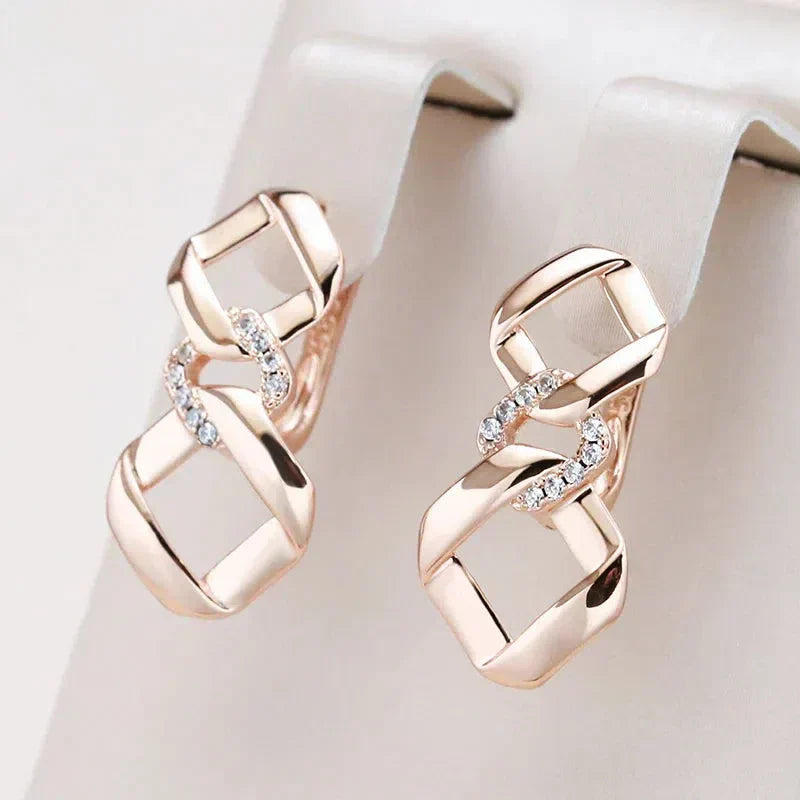 Elegant Gold Earrings with Zirconia and Knotted Design
