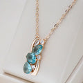 Elegant necklace crafted from blue crystal set in gold.