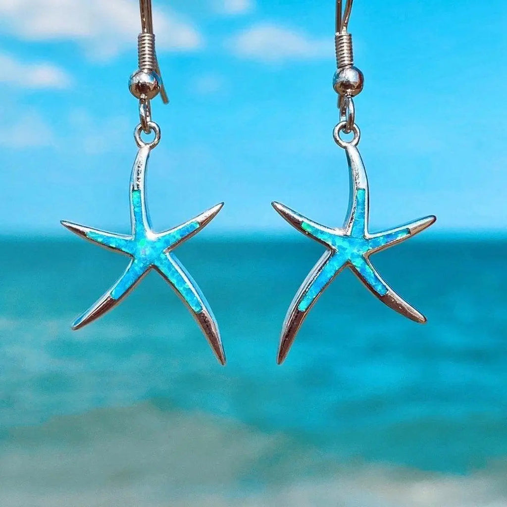 Opal and silver earrings shaped like starfish