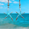 Opal and silver earrings shaped like starfish