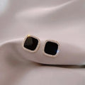 Timeless onyx earrings adorned with diamonds.