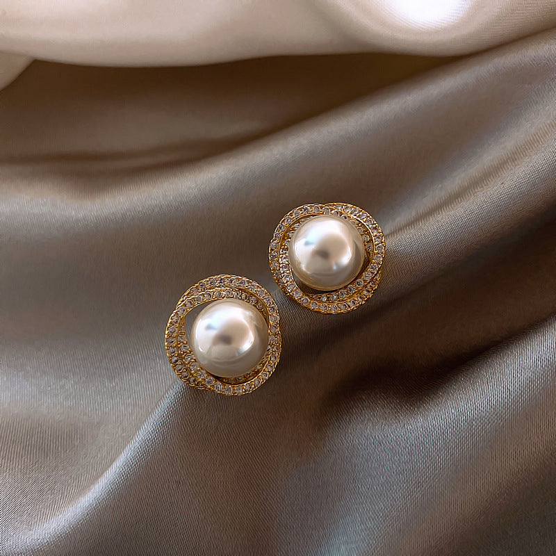 Elegant pearl earrings embellished with diamonds