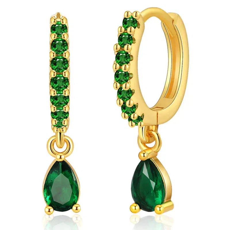 Gold earrings with emerald and zirconia.