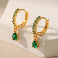 Gold earrings with emerald and zirconia.