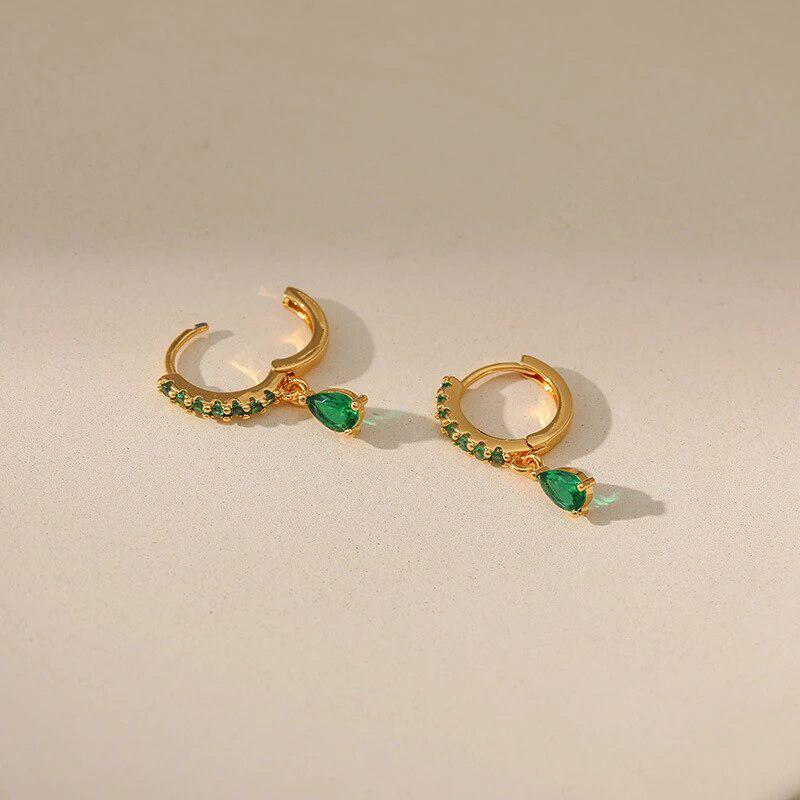 Gold earrings with emerald and zirconia.