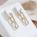 Crossed Diamond Earrings in Golden