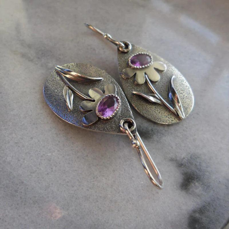 Vintage earrings featuring 3D floral designs