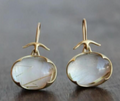Vintage earrings featuring green moonstone.