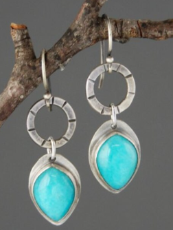 Vintage earrings featuring turquoise inlay