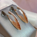 Exquisite Elegant Shimmering Earrings in Gold