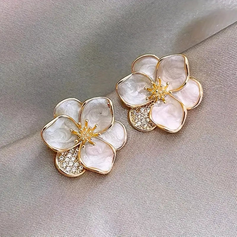 Delicate silver earrings featuring floral accents