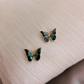 Hand-painted butterfly earrings in golden hue