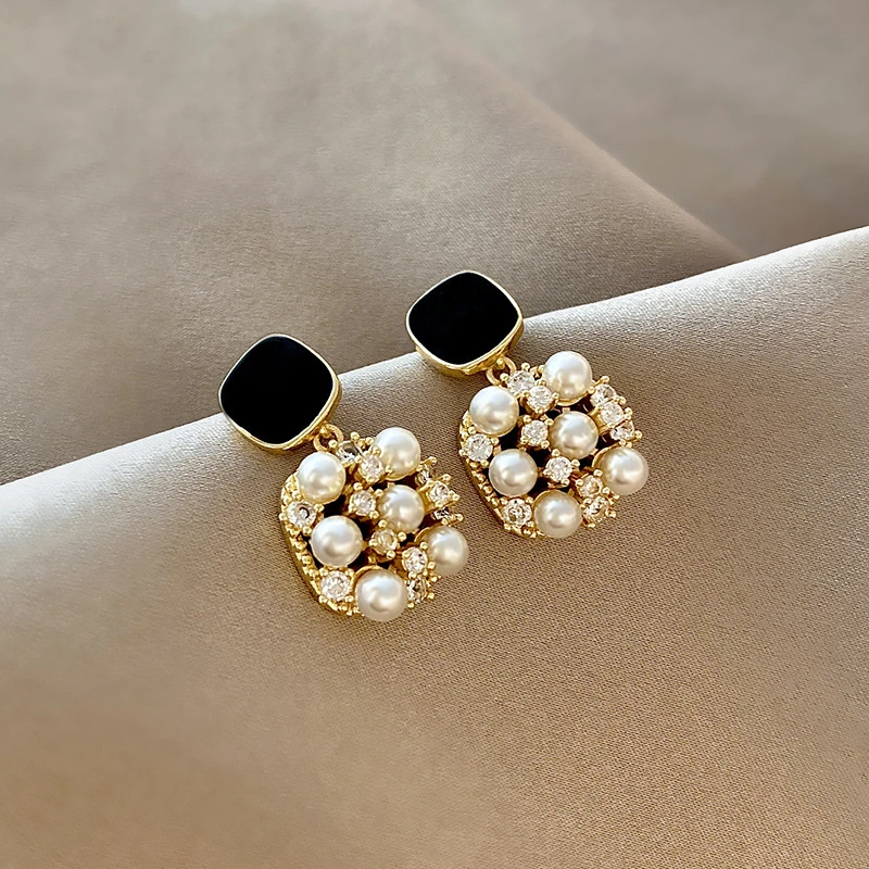 Gold earrings with black opal and pearls