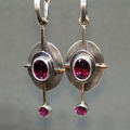 Boho earrings featuring garnet crystal set in sterling silver.