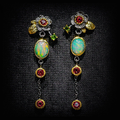 Bohemian earrings featuring opal and red zirconia.