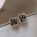 Elegant Black Lotus Earrings with Gold