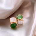 Elegant earrings featuring white and green stones set in gold