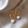 Golden earrings adorned with pearls