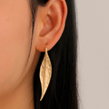 Vintage earrings with a golden leaf design