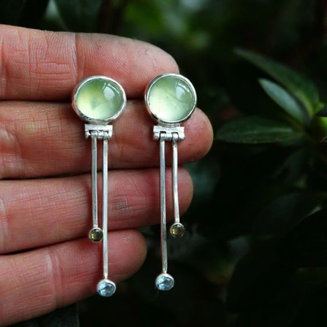 Vintage earrings crafted from green crystal