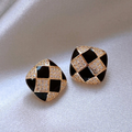 Elegant shiny earrings crafted from black enamel.