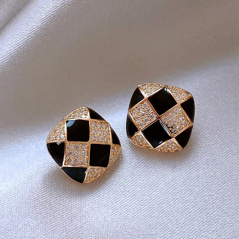 Elegant shiny earrings crafted from black enamel.