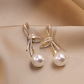 Gold Pearl Earrings with Glossy Bow