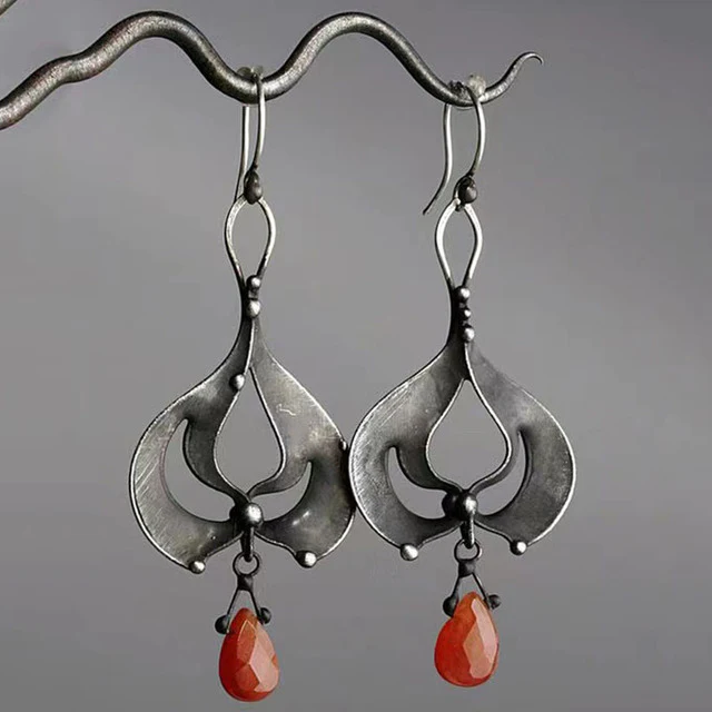 Vintage earrings featuring red crystals