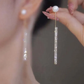 Elegant luminous dangling pearl earrings