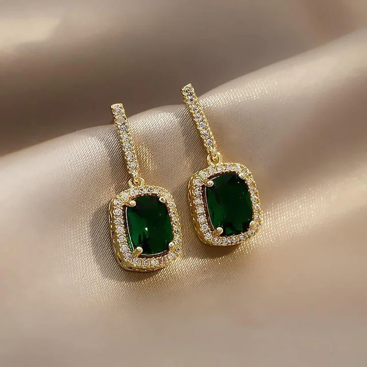 Elegant earrings adorned with shimmering green crystals