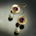 Elegant earrings crafted from pearls and amethyst zirconia.