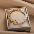 Elegant Gold and Pearl Bangle